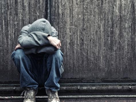 Young boy alone and sad in an urban setting. Photo: iStock