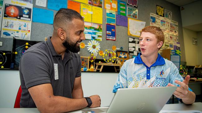 Charles Darwin University (CDU) third year Bachelor of Public Health student Shaheer Muhammad takes Dripstone Middle School Year 9 student Evan Parker through setting up a myGov account. Picture: Supplied