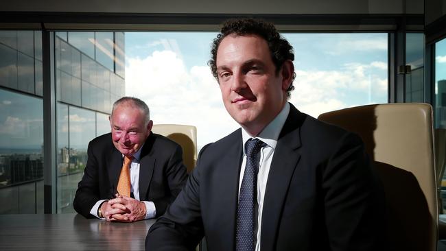 Hugh Robertson Snr with son Hugh at their office in Melbourne. Picture: Luis Enrique Ascui