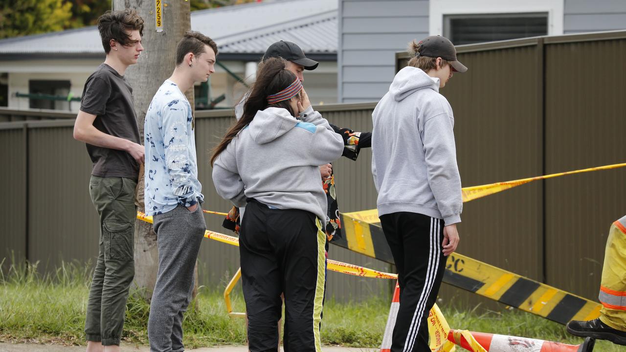 People gathered at the crash site on Sunday.