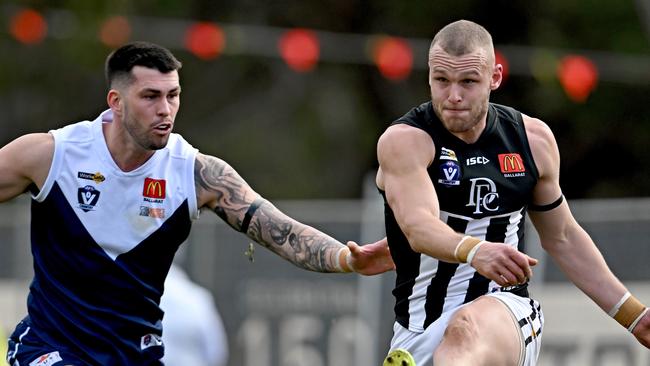 Melton South’s Darby Schilder battles Darley’s Brett Bewley earlier this season. Picture: Andy Brownbill