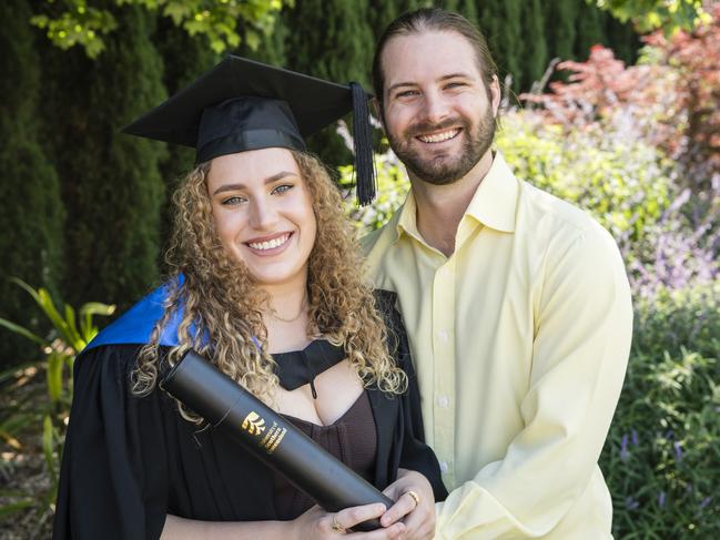 Lauren Staines celebrates completing her post graduate diploma of counselling with Chris Fisher at a UniSQ graduation ceremony at Empire Theatres, Tuesday, October 31, 2023. Picture: Kevin Farmer