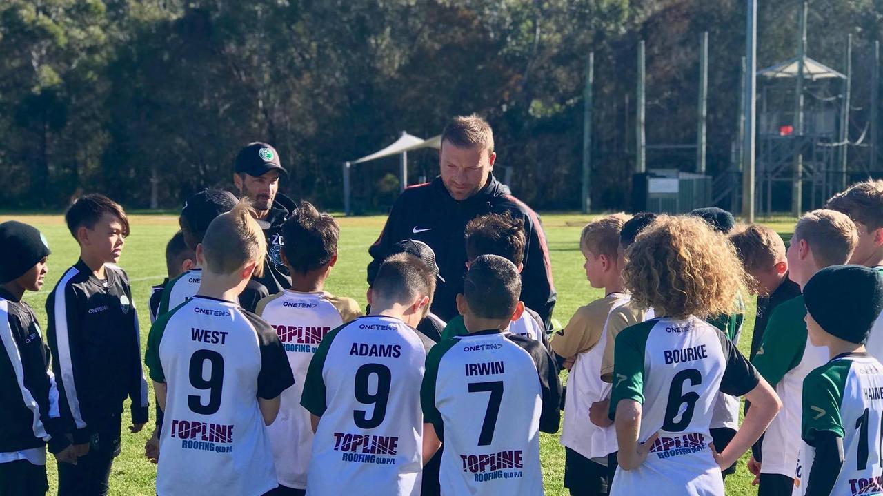 Caravella Football Academy players get some advice from  championship winning Western Sydney Wanderers youth coach Arthur Diles during their recent trip to Sydney