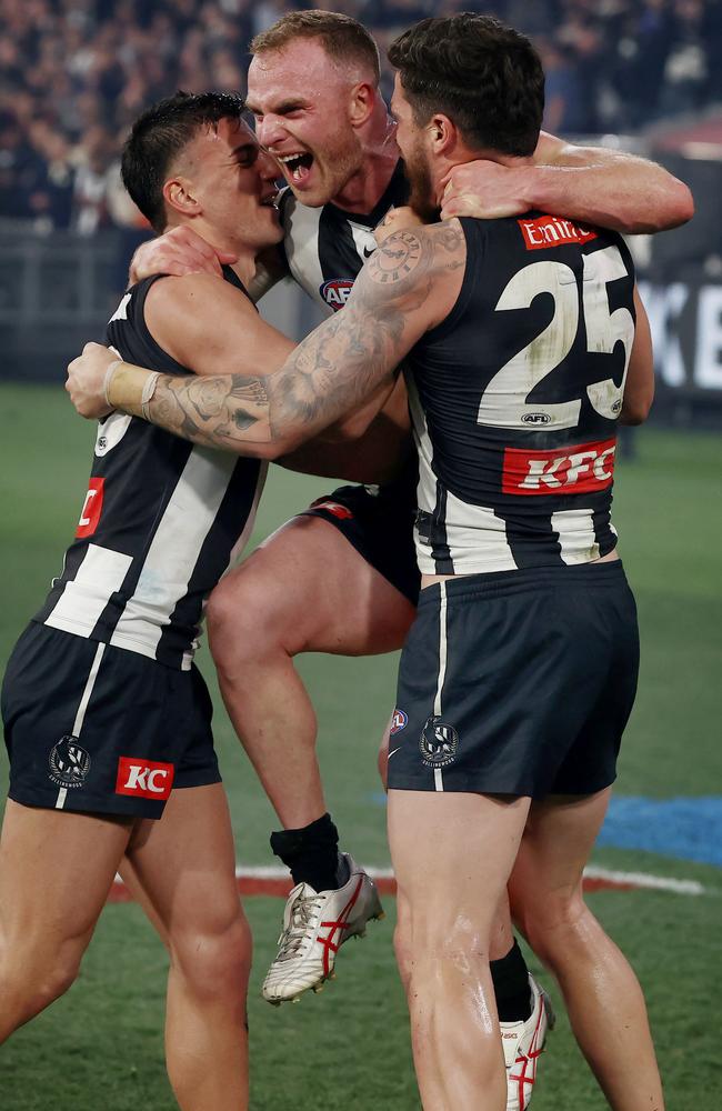 Tom Mitchell – celebrating with Nick Daicos and Jack Crisp – was massive in the final term. Picture: Michael Klein