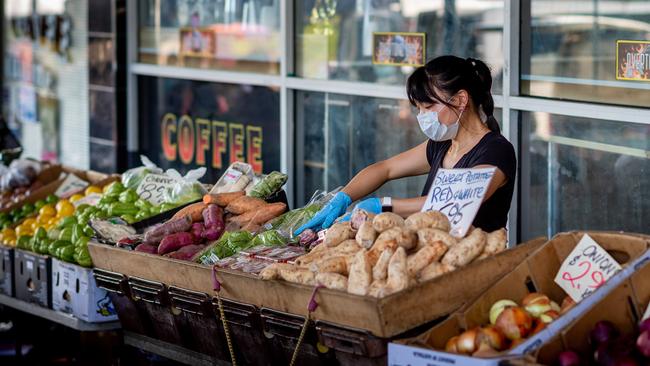 Stallholder Melody Zeuo and her vegetable stall at the Rapid Creek Markets on Sunday, March 29. Picture: Che Chorley