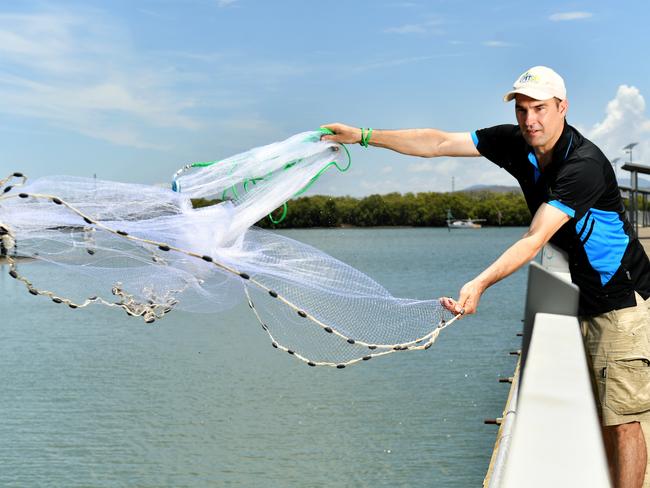 Project Manager  Dr Geoff Collins of OzFish casting out a net at Townsville Recreational Boating Park. Picture: Alix Sweeney