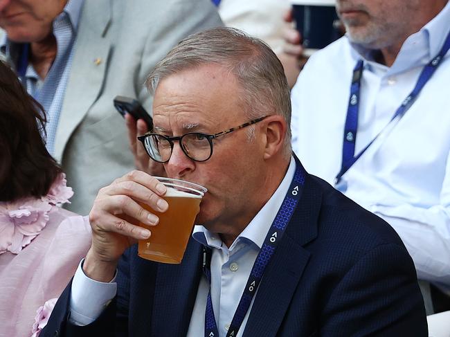 Prime Minister Anthony Albanese drinks a beer at the Australian Open. Picture: Michael Klein