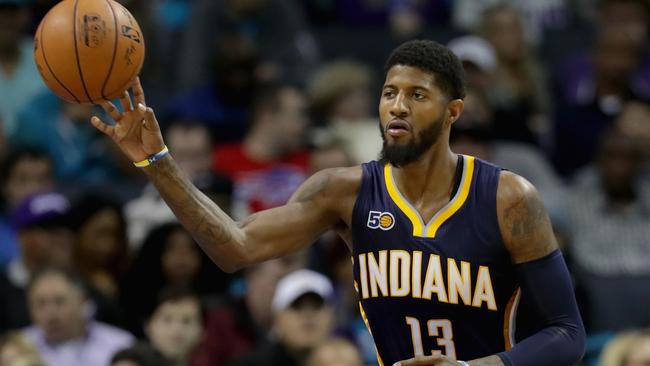 Paul George #13 of the Indiana Pacers brings the ball up the court.