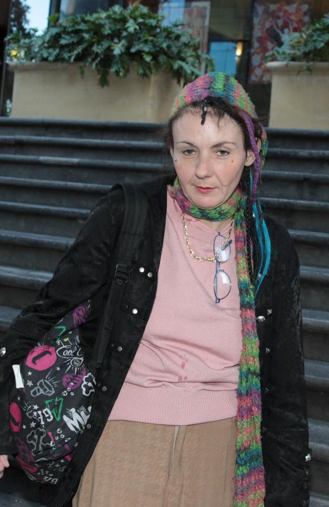 Alleged axe attack victim Sharon Hacker leaves after giving evidence at the trial of Evie Amati at the Downing Centre District Court. Picture: Ben Rushton.