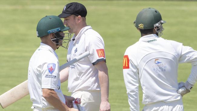 Jason Hughes walks past Dave Warner at Pratten Park. Picture: Jenny Evans