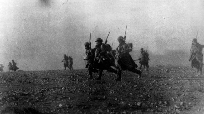 Australian infantry soldiers advance on the Italian held fortress at Bardia in Libya. Picture: Supplied / Imperial War Museum