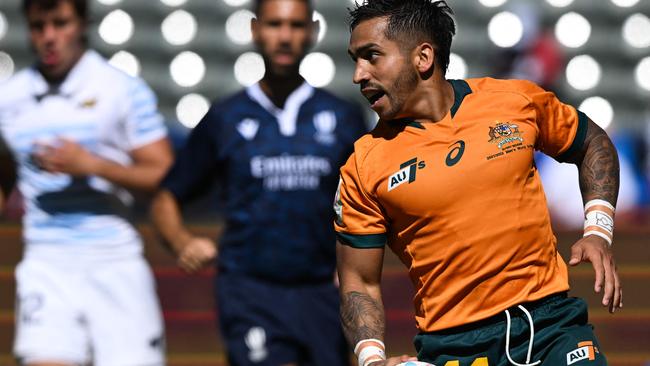 Australia's Maurice Longbottom scores a try against Argentina. Picture: AFP