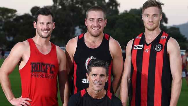 Rostrevor Old Collegians ahead of the 2017 season, where it won the division one flag. Brendan Littler, captain Will O'Malley and Craig Holm with coach Adrian Rocco. Picture: Roger Wyman