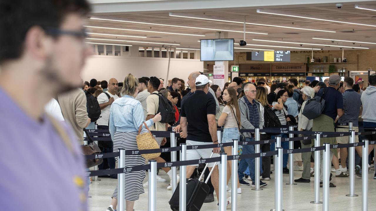 The winding queue for security checks at Adelaide Airport’s domestic departures. Picture: NCA NewsWire / Kelly Barnes