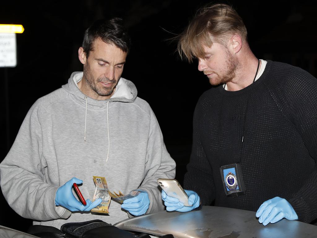 Redfern Region Enforcement Squad found cash during a search of a car at about 8.30pm on Friday (14 May 2021). During the operation Strike Force Northrop to find dial-a-dealers in Sydney the Redfern Region Enforcement Squad (RES) found in total, $12,130 cash, 38g of cocaine, 4.2g of ketamine, 4.9g of MDMA and a knife. The combined estimated potential street value of the prohibited drugs seized is nearly $21,000. Picture: Jonathan Ng