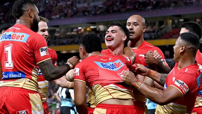 BRISBANE, AUSTRALIA – MAY 06: Valynce Te Whare of the Dolphins celebrates with team mates after scoring a try during the round 10 NRL match between Cronulla Sharks and Dolphins at Suncorp Stadium on May 06, 2023 in Brisbane, Australia. (Photo by Bradley Kanaris/Getty Images)