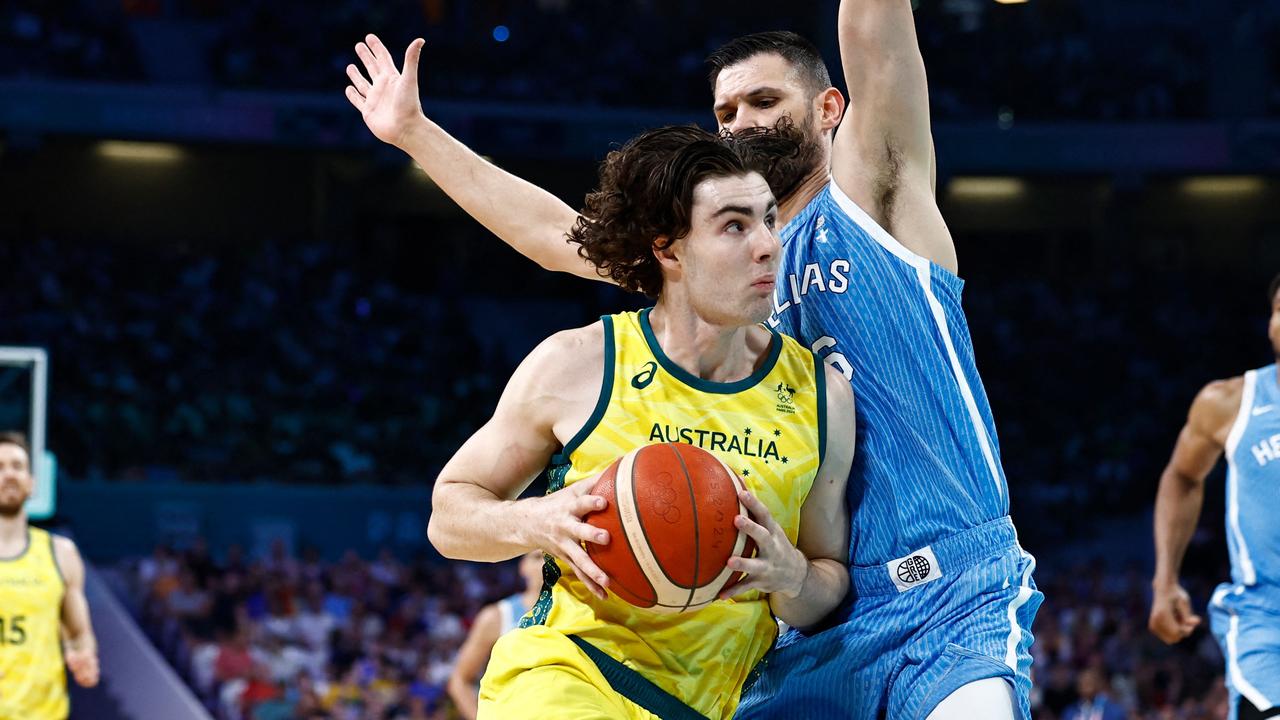 Josh Giddey drives to the basket against Greece. Photo by Sameer Al-Doumy / AFP.