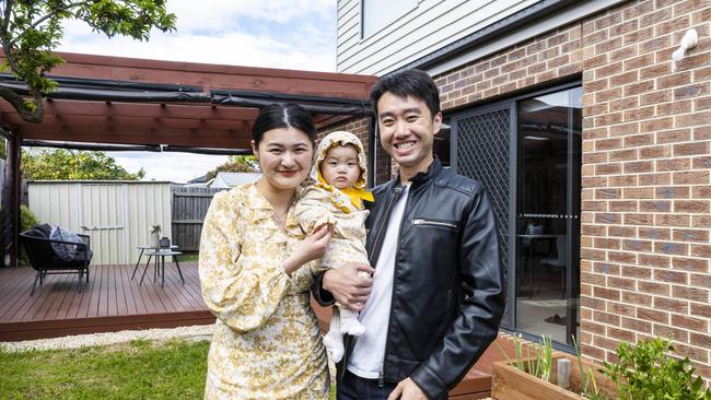 Karen He and Chang Lin with their nine-month-old daughter Mia in the rear garden of their four-bedroom townhouse at 2/17 Moorookyle Ave, Hughesdale, which is for sale. Picture: Aaron Francis.