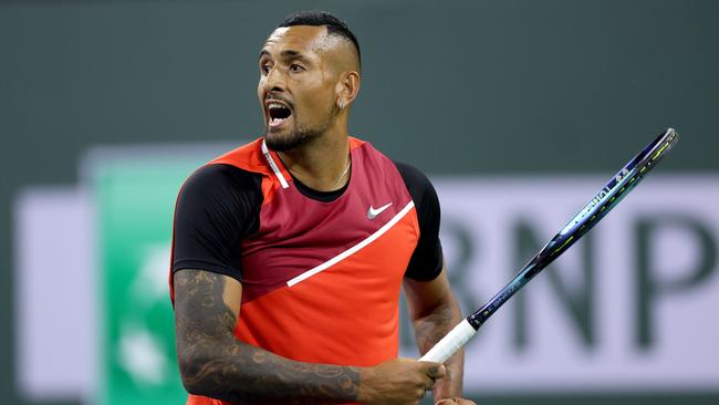 INDIAN WELLS, CALIFORNIA – MARCH 14: Nick Kyrgios of Australia returns a shot to Casper Ruud of Norway of during the BNP Paribas Open at the Indian Wells Tennis Garden on March 14, 2022 in Indian Wells, California. Matthew Stockman/Getty Images/AFP == FOR NEWSPAPERS, INTERNET, TELCOS &amp; TELEVISION USE ONLY ==