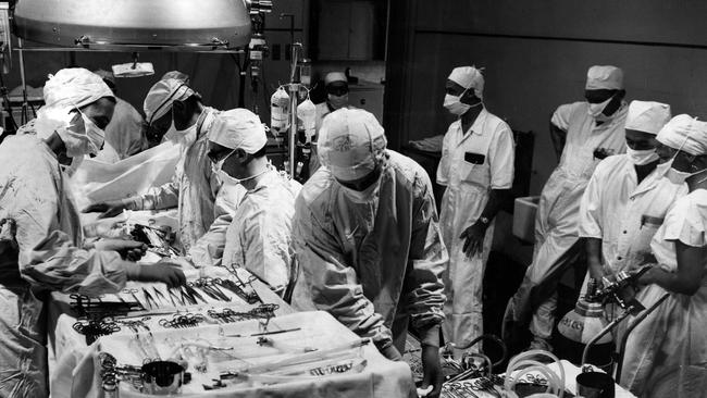 Some of the 15 people needed to help mend a heart at the RCH in 1961. Picture: The Herald