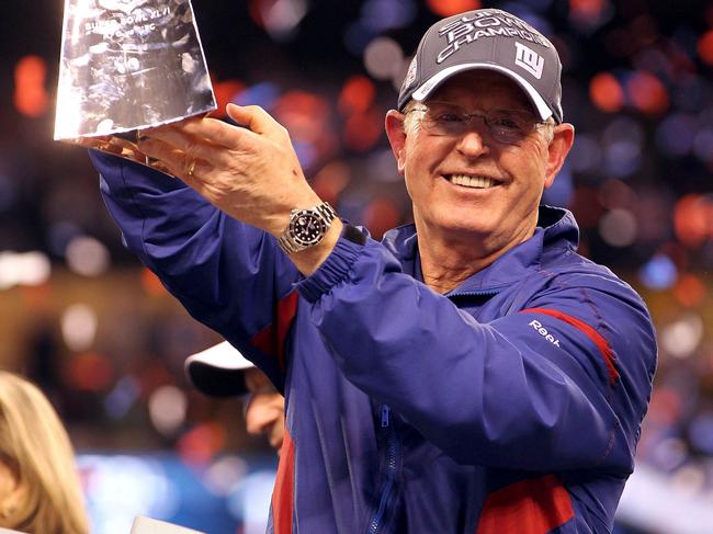 INDIANAPOLIS, IN - FEBRUARY 05: Head coach Tom Coughlin of the New York Giants celebrates with the Vince Lombardi Trophy after defeating the New England Patriots in Super Bowl XLVI at Lucas Oil Stadium on February 5, 2012 in Indianapolis, Indiana. The New York Giants defeated the New England Patriots 21-17. Jamie Squire/Getty Images/AFP== FOR NEWSPAPERS, INTERNET, TELCOS & TELEVISION USE ONLY ==