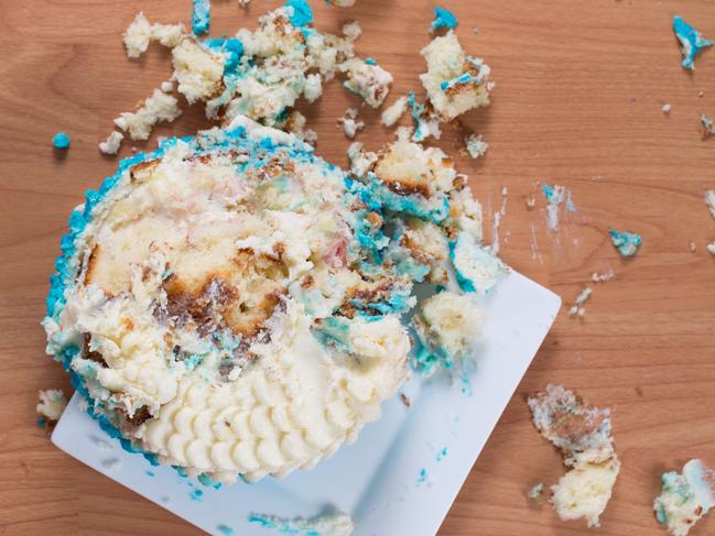 Smashed birthday cake on floor