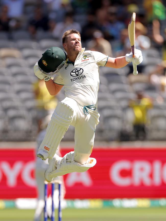 David Warner celebrates on reaching a century. AAP Image/Richard Wainwright.