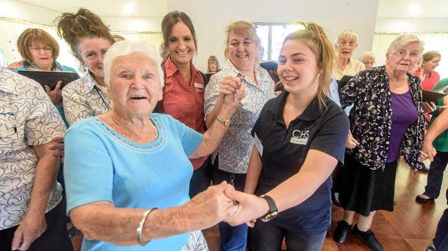 IN TUNE: Dougherty Villa resident Evelyn Gane,  Work Placement student Kara-leigh Hartog  and Dougherty Villa staff and volunteers sing along with the U3A Good Vibes choir. Picture: Adam Hourigan