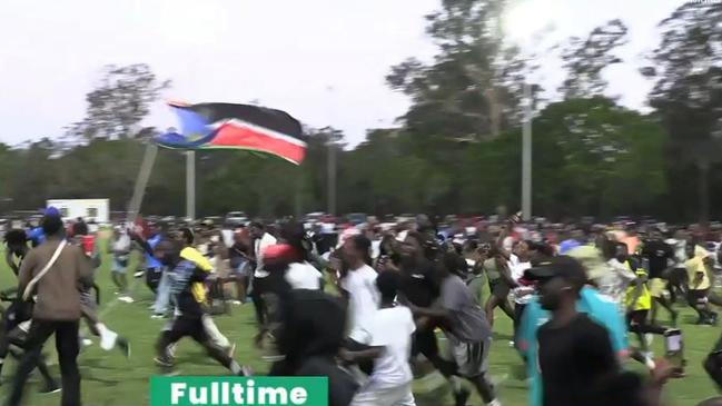 Large crowds of supporters flooded the field to celebrate shortly before the evacuation. Source: AFCON Live