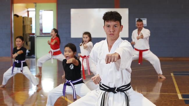 Fudoshin Shitoryu Karate classes have begun again at Cairns State High School, after a strict COVID Safe plan was implemented. Black belt student Joshua Long runs a drill for other students who are socially distanced. PICTURE: BRENDAN RADKE