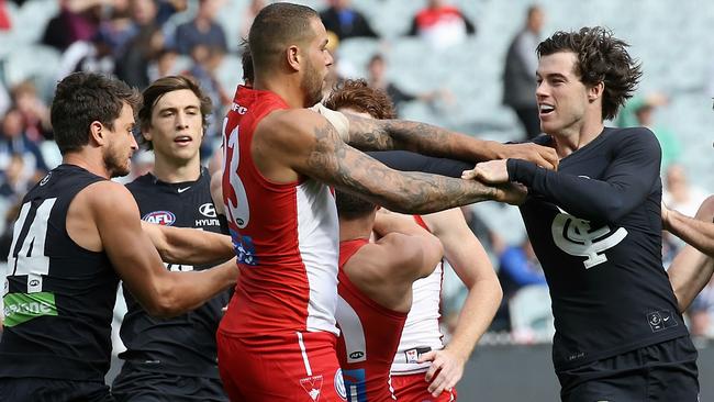 Lance Franklin gets into a scuffle with Lachie Plowman. Picture: Wayne Ludbey