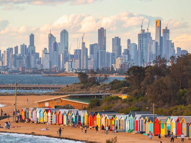 Brighton bathing boxes and Melbourne skyline.Escape 27 August 2023Twin Share - Neil WhitakerPhoto - Getty Images