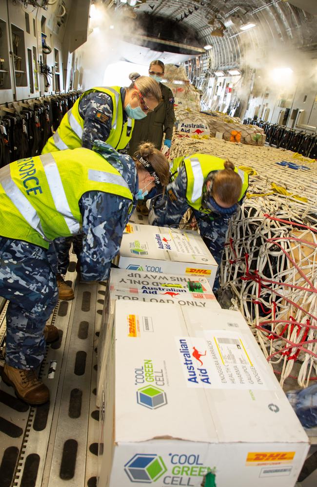 Australian military staff load vaccines onto a Papua New Guine-bound plane. Picture: Supplied