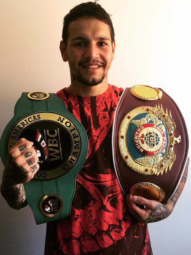 Tully boxer Fleming with his belts.