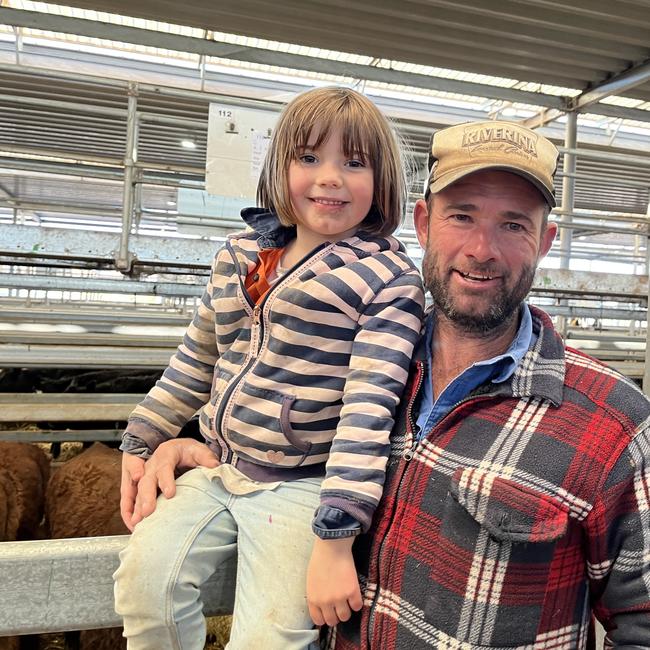 Wakool buyer Matt Pattison and daughter Zali, 4, planning to buy heifers at the Wodonga store cattle sale.