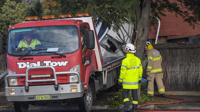 A tow truck starts removing the vehicle. Picture: Roy VanDerVegt