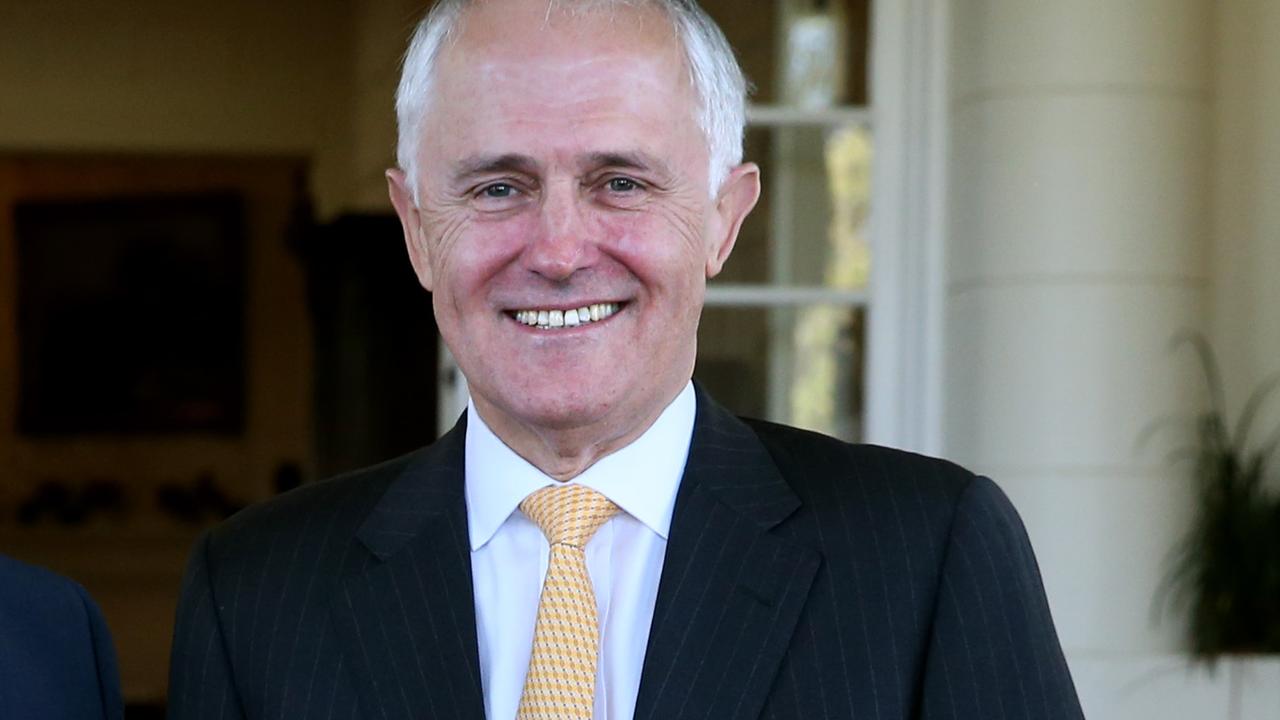 Assistant Minister for Health Ken Wyatt and PM Malcolm Turnbull after the swearing in ceremony at Government House in Canberra.