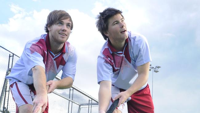 Sam Coonan and his brother Josh (left) photographed in their Central Coast gear ahead of the NSW hockey titles in 2009. Picture: Mark Scott