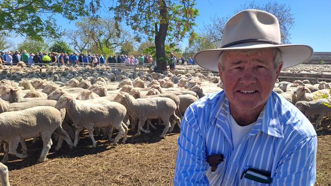 Greg Rogers, Yarto, Booligal, NSW, with his pen of ewes which topped the Hay Merino sheep sale at $252.