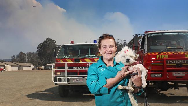 Kaylee Hattinger, owner of the Great Lakes Hotel, with her dog, Betty. Kaylee is adamant she will stay and defend the hotel if the fire comes to the township of Miena. Picture: LUKE BOWDEN