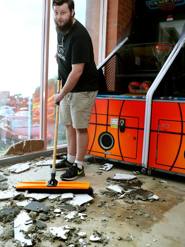 Oz Tenpin Geelong manager Michael Reeve cleans up after the storms. Picture: Alison Wynd