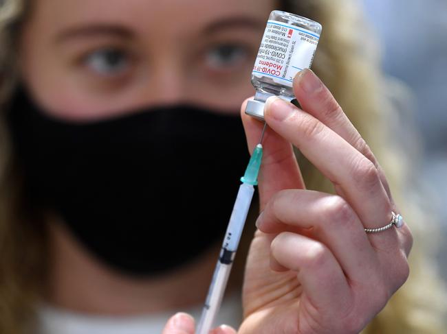 BRISBANE, AUSTRALIA - NewsWire Photos - SEPTEMBER 22, 2021. Intern Pharmacist Alexandra Bradshaw draws the Moderna Covid-19 vaccine into a syringe at a pharmacy in Brisbane. Pharmacies have began administering the Moderna vaccine to anyone over 12 years-old.Picture: NCA NewsWire / Dan Peled