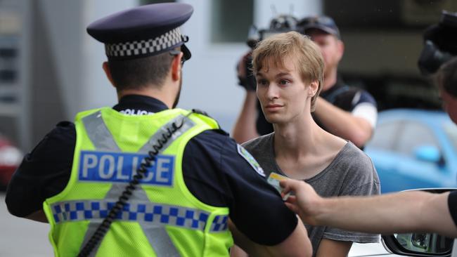 A police officers speaks to one of the demonstrators. Picture: Mark Brake