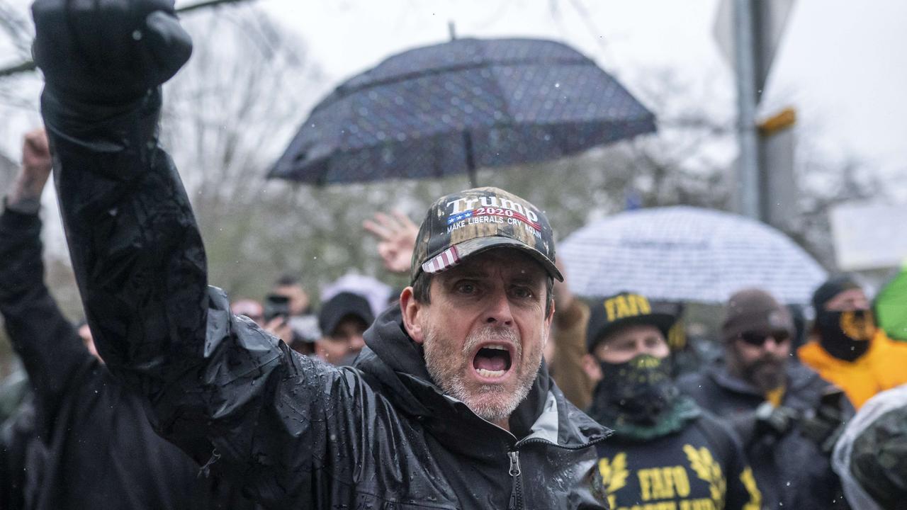 A supporter of President Trump yells toward counter-protesters on January 6 in Salem, Oregon. Trump supporters gathered at state capitals across the country to protest the ratification of Joe Biden's Electoral College victory over President Trump. Picture: Nathan Howard/Getty Images/AFP.