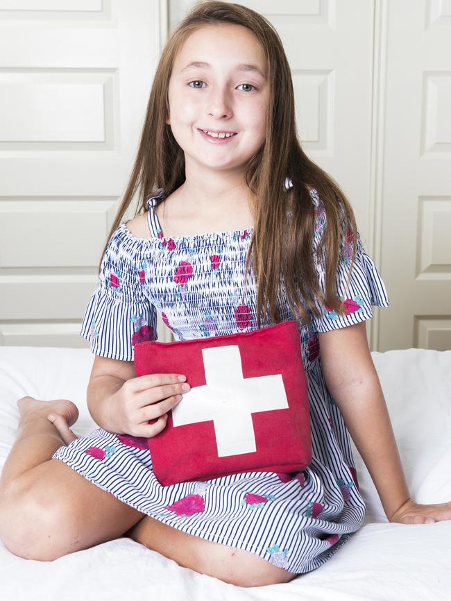 10-year-old Jazmine Bennett who has life-threatening allergies to peanuts and pine kernels, at home on the Sunshine Coast with her medical bag containing her life-saving adrenalin-injecting EpiPen. Photo: Lachie Millard.