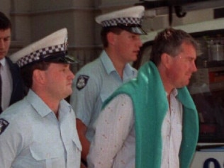 Ashley Coulston, right, with police in 1993.