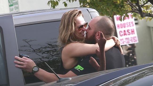 Ronda Rousey spotted kissing boyfriend Travis Browne shortly after leaving their gym in Los Angeles. Picture: Sharky/Splash News.