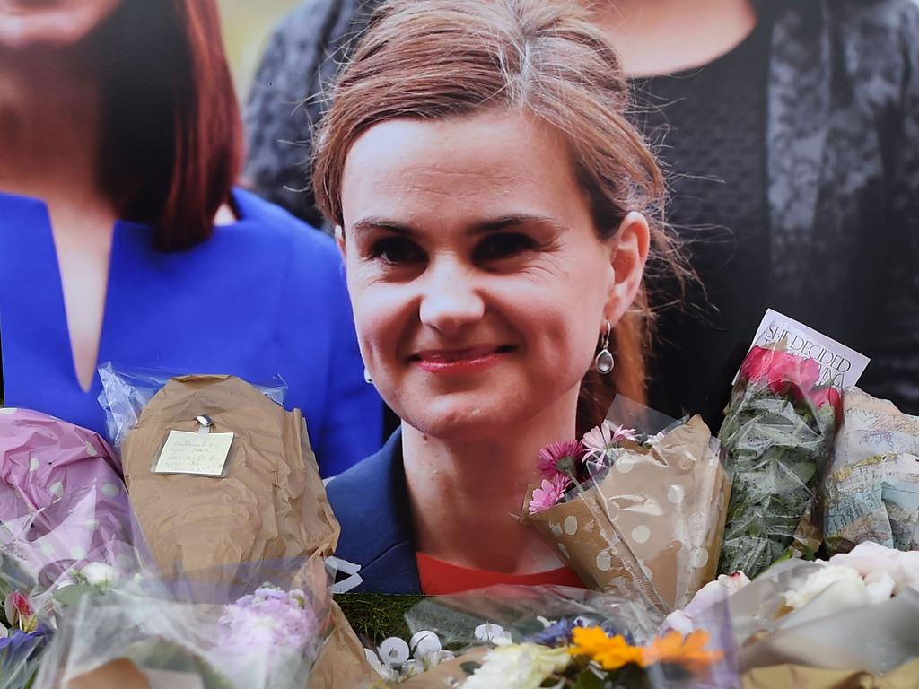 Flowers and tributes laid in remembrance against a photograph of slain Labour MP Jo Cox in Parliament Square central London on June 18, 2016. Picture: Ben Stansall/AFP