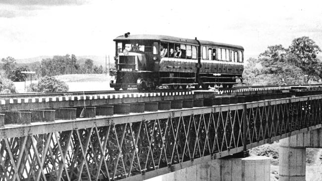 The high-level rail bridge at Mirani was opened on December 3, 1959. The photograph shows the Mackay-Netherdale rail motor making its first run over the bridge on December 4. Picture: Daily Mercury Archives