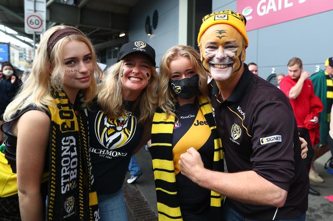 BRISBANE, AUSTRALIA - OCTOBER 24: Tigers fans pose before the 2020 AFL Grand Final match between the Richmond Tigers and the Geelong Cats at The Gabba on October 24, 2020 in Brisbane, Australia. (Photo by Chris Hyde/AFL Photos/via Getty Images)